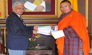 The Indian Ambassador Haran, handed over a cheque worth Rs. 1 billion to the PM Tshering Tobgay. Photo: PM's facebook