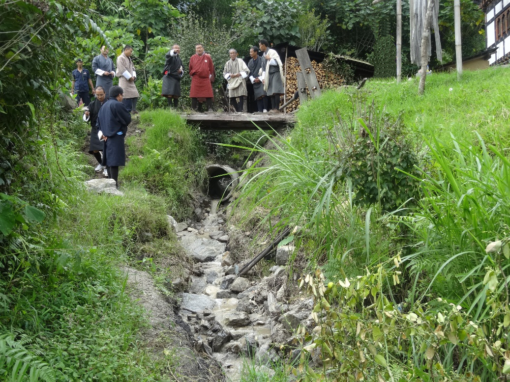 Inspecting the area in Kabisa that had been affected by flood waters in Punakha district