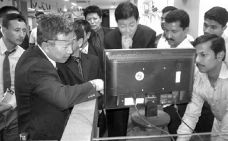 Bhutan officials having a close look on Aadhaar registration process at the Citizen Call Centre in Thiruvananthapuram on Friday. Photo: The New India Express