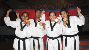 Ayasha Shakya (red) of Nepal kicks Shahnaz Khatun of Bangladesh in the women’s U-67 kg final of the Second Mount Everest International Open Taekwondo Championship at the NSC covered hall in Tripureshwar, Kathmandu, on Sunday. (Photos: Dipesh Shrestha/Republica)