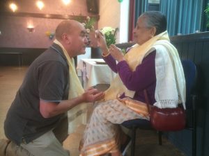 Receiving Tika from senior member of the community
